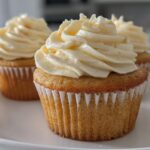 Close-up of vanilla cupcakes with creamy frosting, showcasing easy cupcake recipes