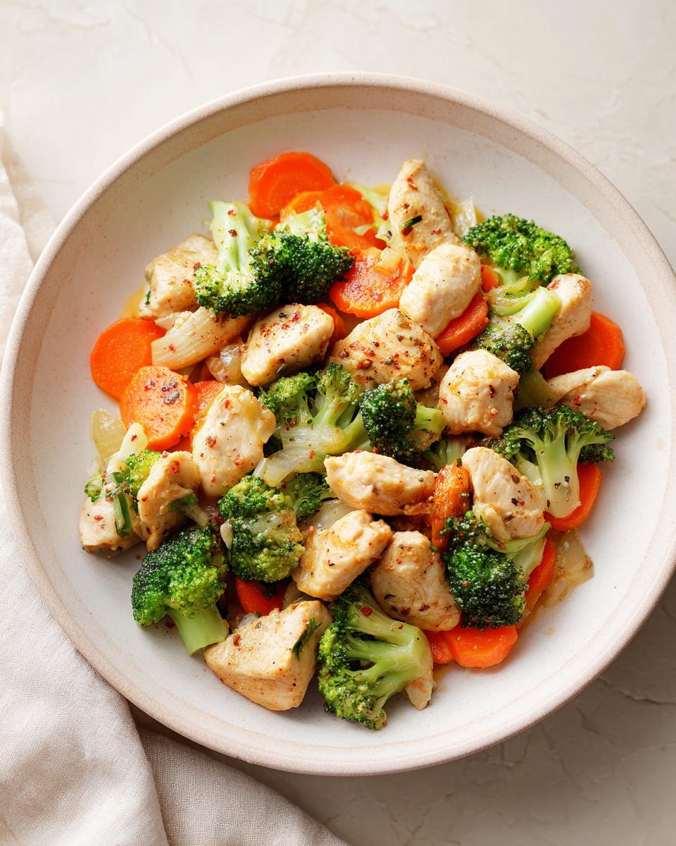 Bowl of healthy chicken stir-fry with broccoli and carrots for healthy dinner recipes
